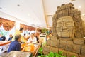 Guest and face of Bayon in restaurant. Phnom Phenh City. Royalty Free Stock Photo